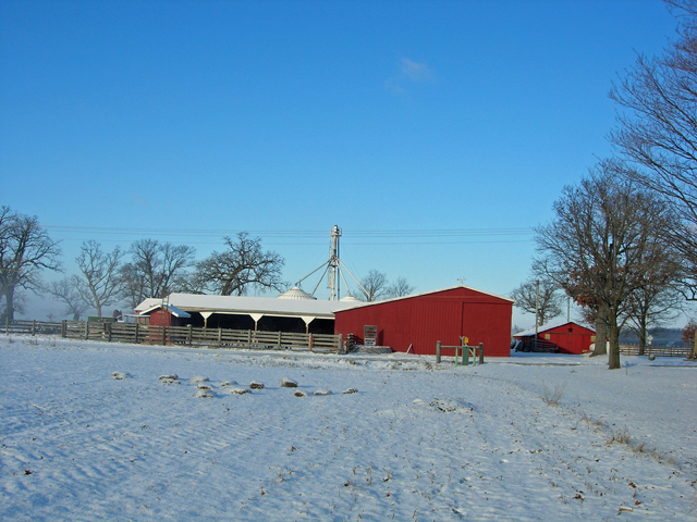 The barn and feedlot on a winter day
